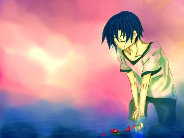 夕暮れの海に花を